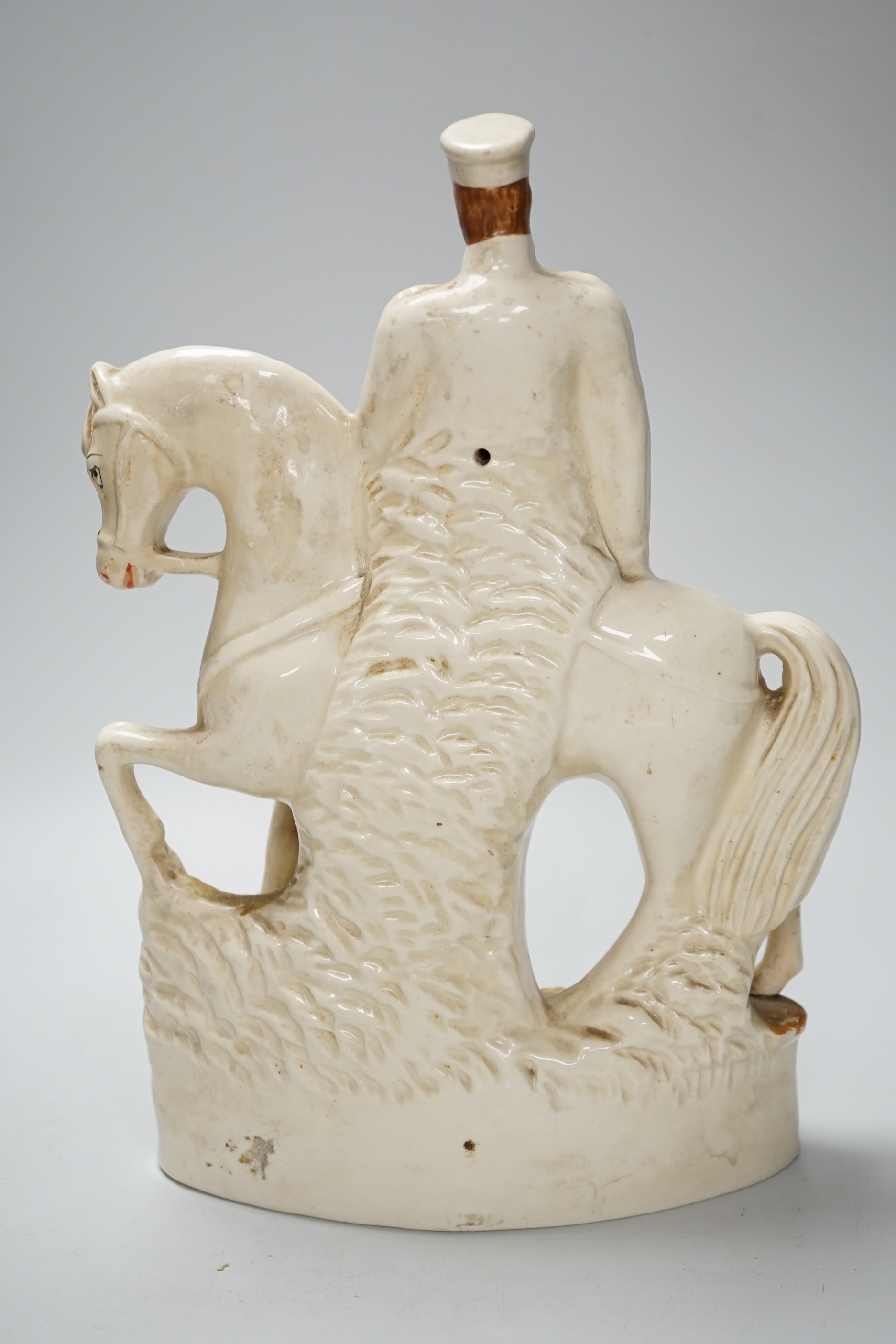 A pair of Staffordshire 'market' groups and a General Sir Redvers Buller equestrian group (3), 30cm